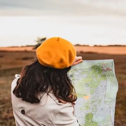 A woman holds a map